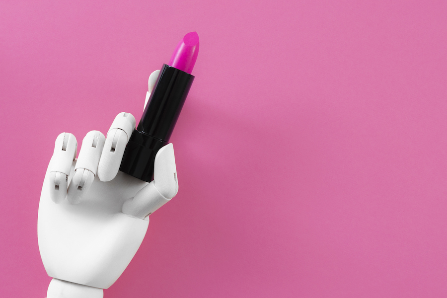 robot hand holding lipstick – salon automation with AI